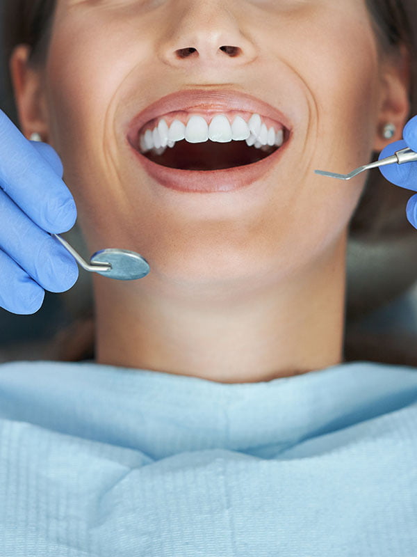 male-dentist-and-woman-in-dentist-office-2022-05-13-01-26-49-utc